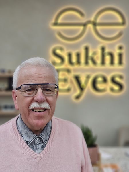 Guest in navy and silver rectangular frames