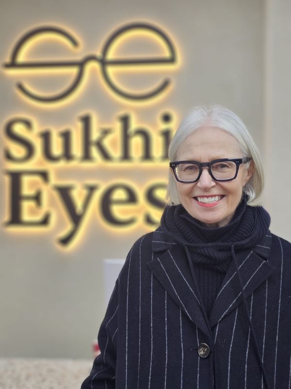 Guest in bold black optical frames