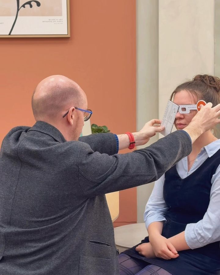 Ben taking fitting measurements for a guest's new glasses